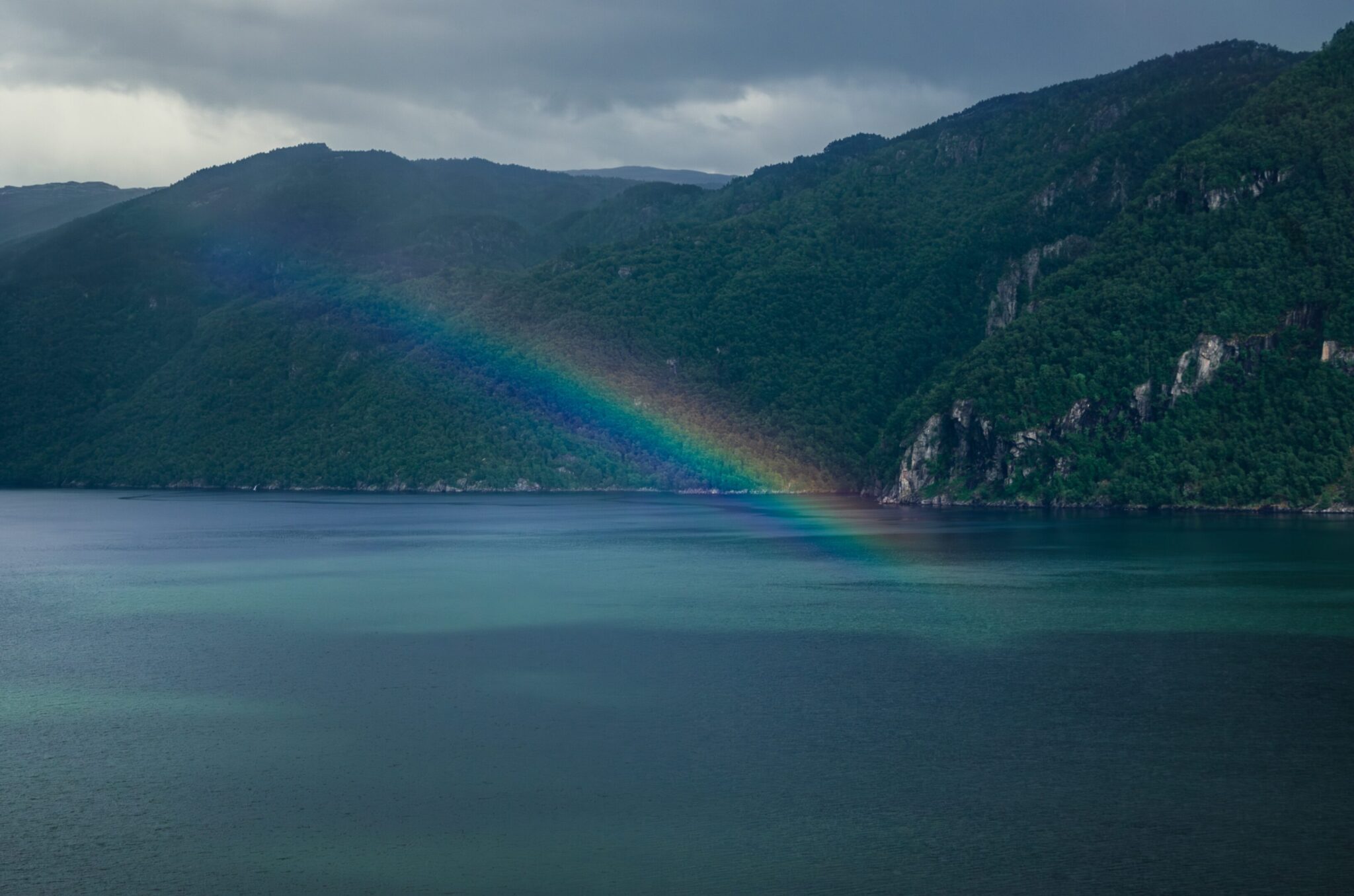 Norwegian fjord and rainbow