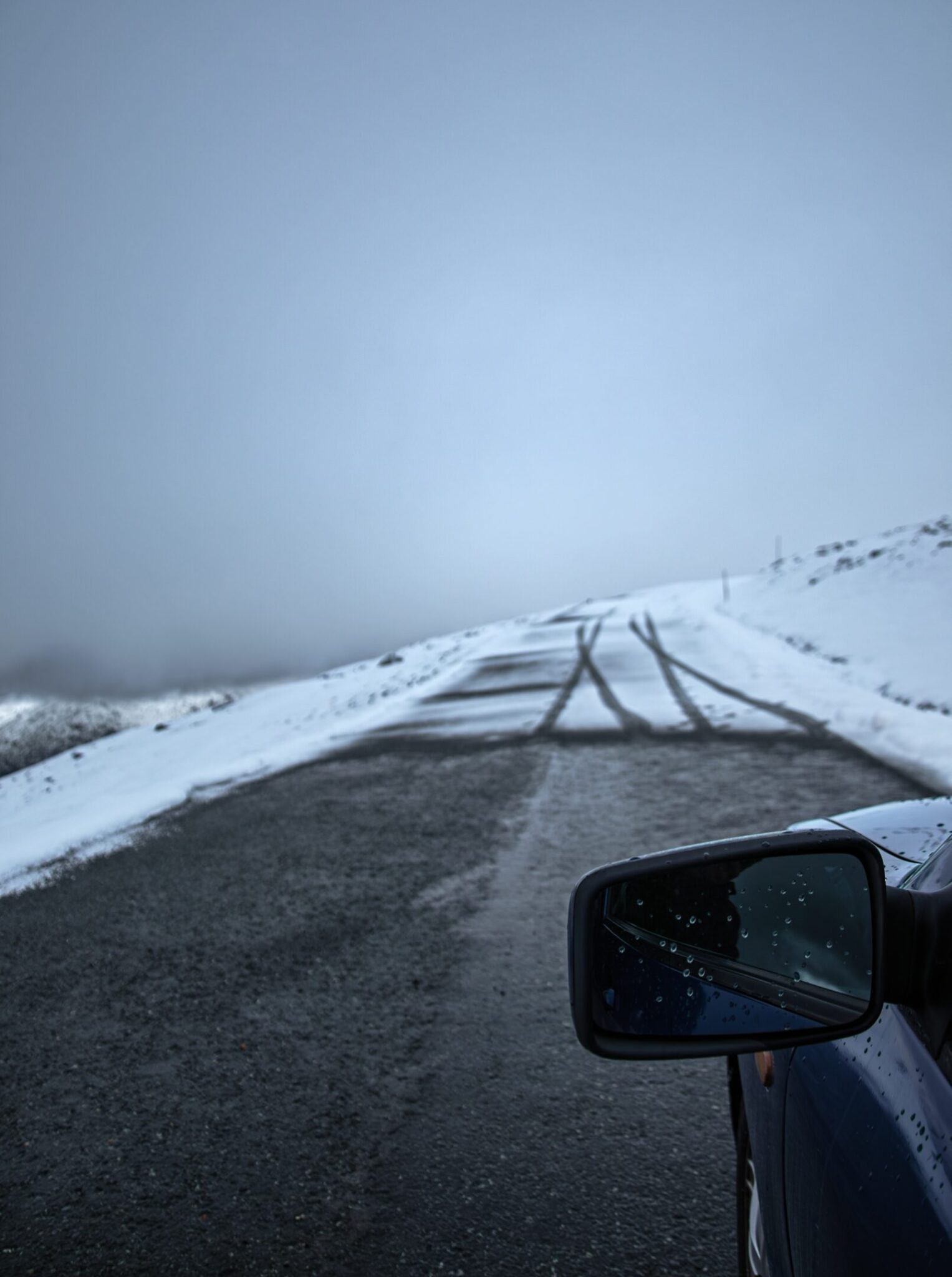 Seat Toledo mirror which standing on the road in the middle of a snow-covered area in Norway