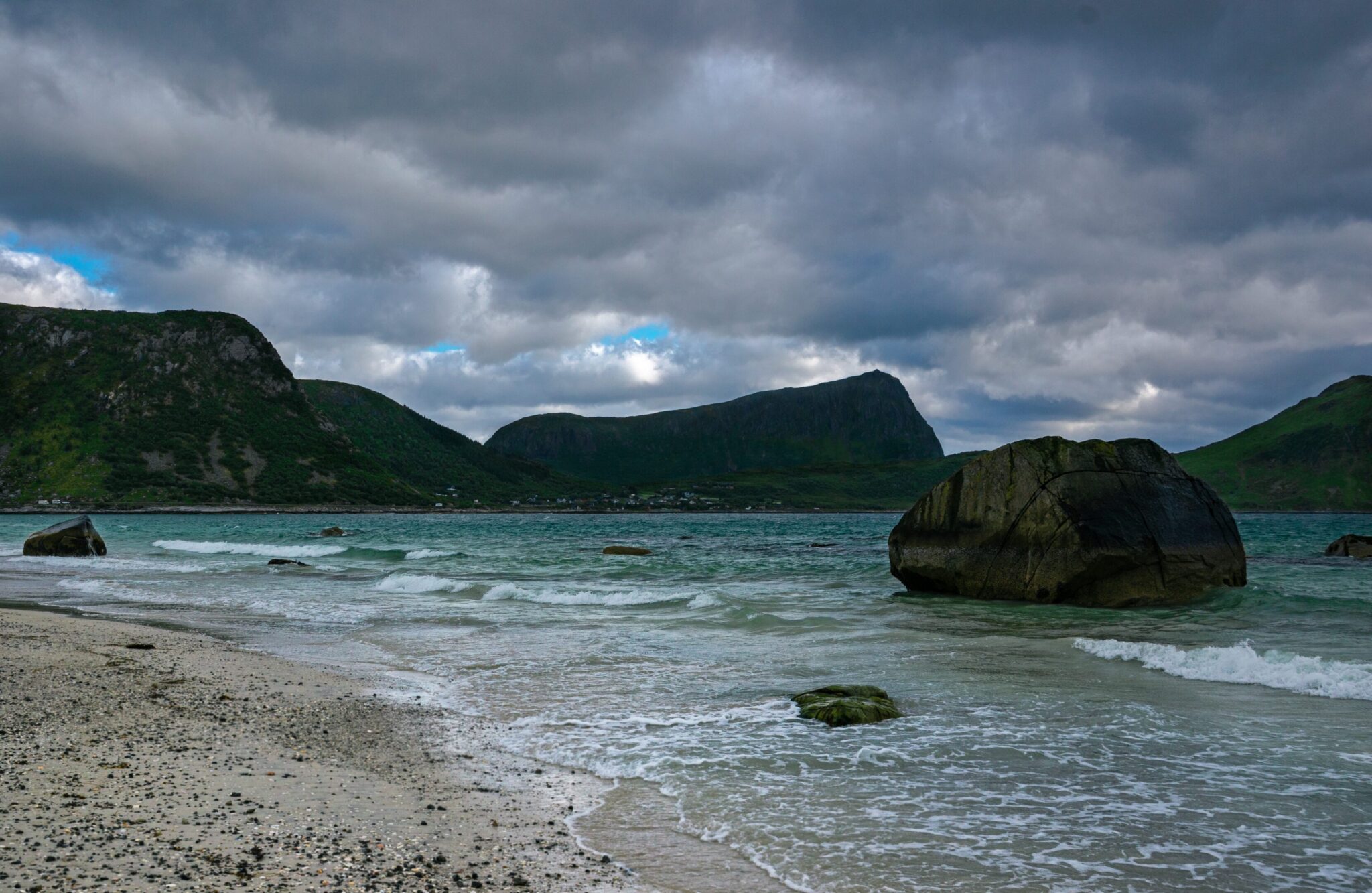View of seat beach rock and mountains in Lofoten