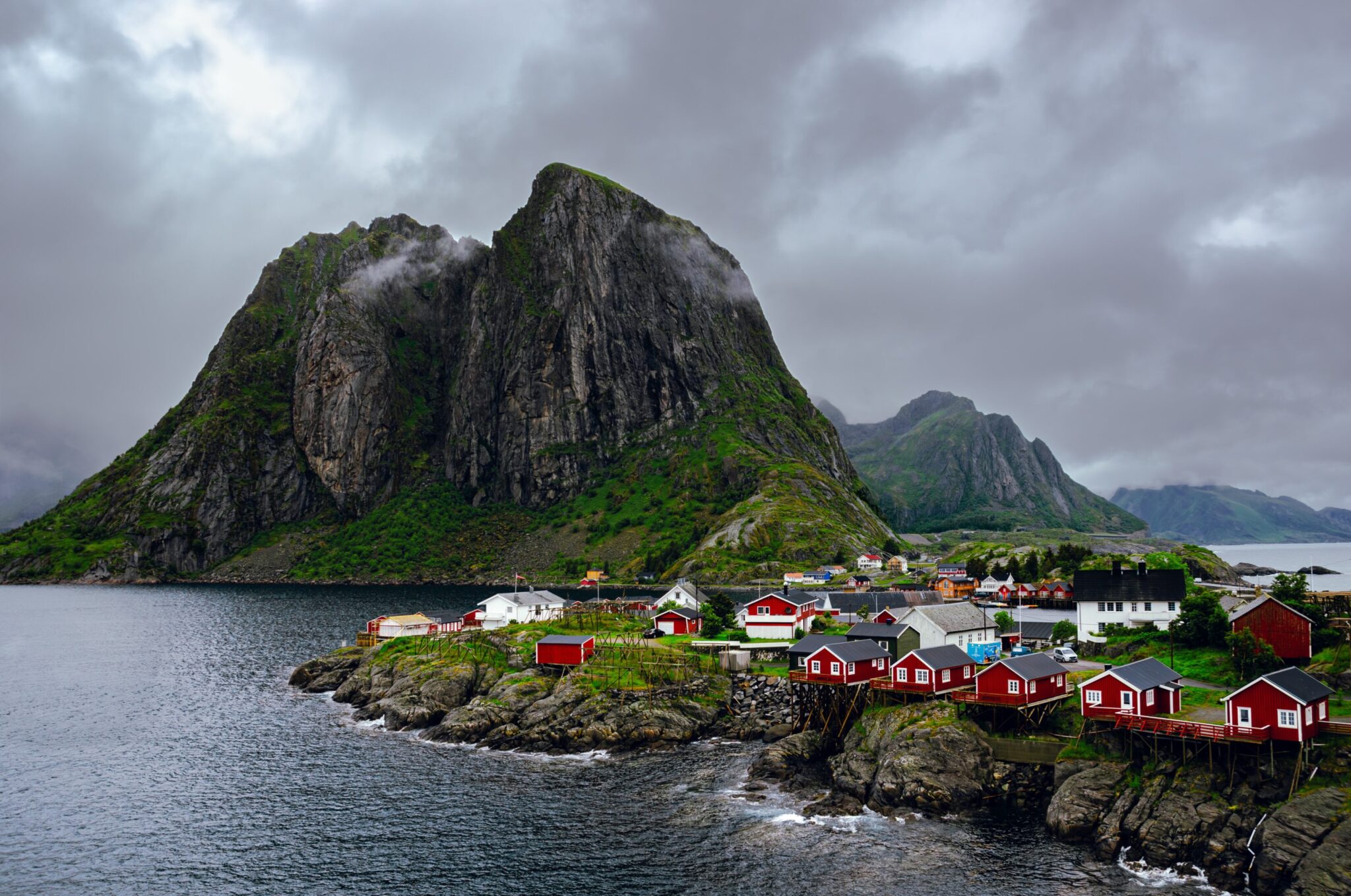 Red houses and mountains in Hamnøy town in Lofoten