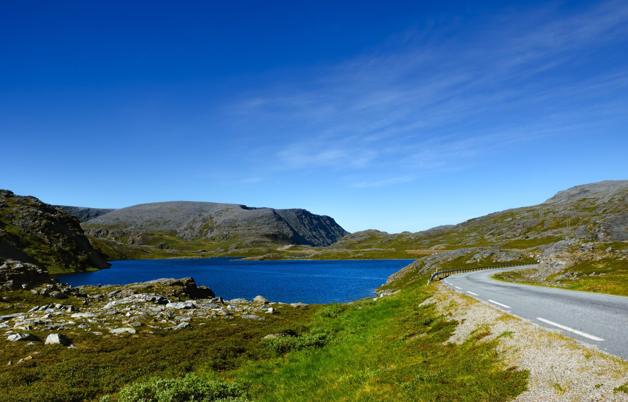 Lake, mountains and road above the Arctic Circle in Norway
