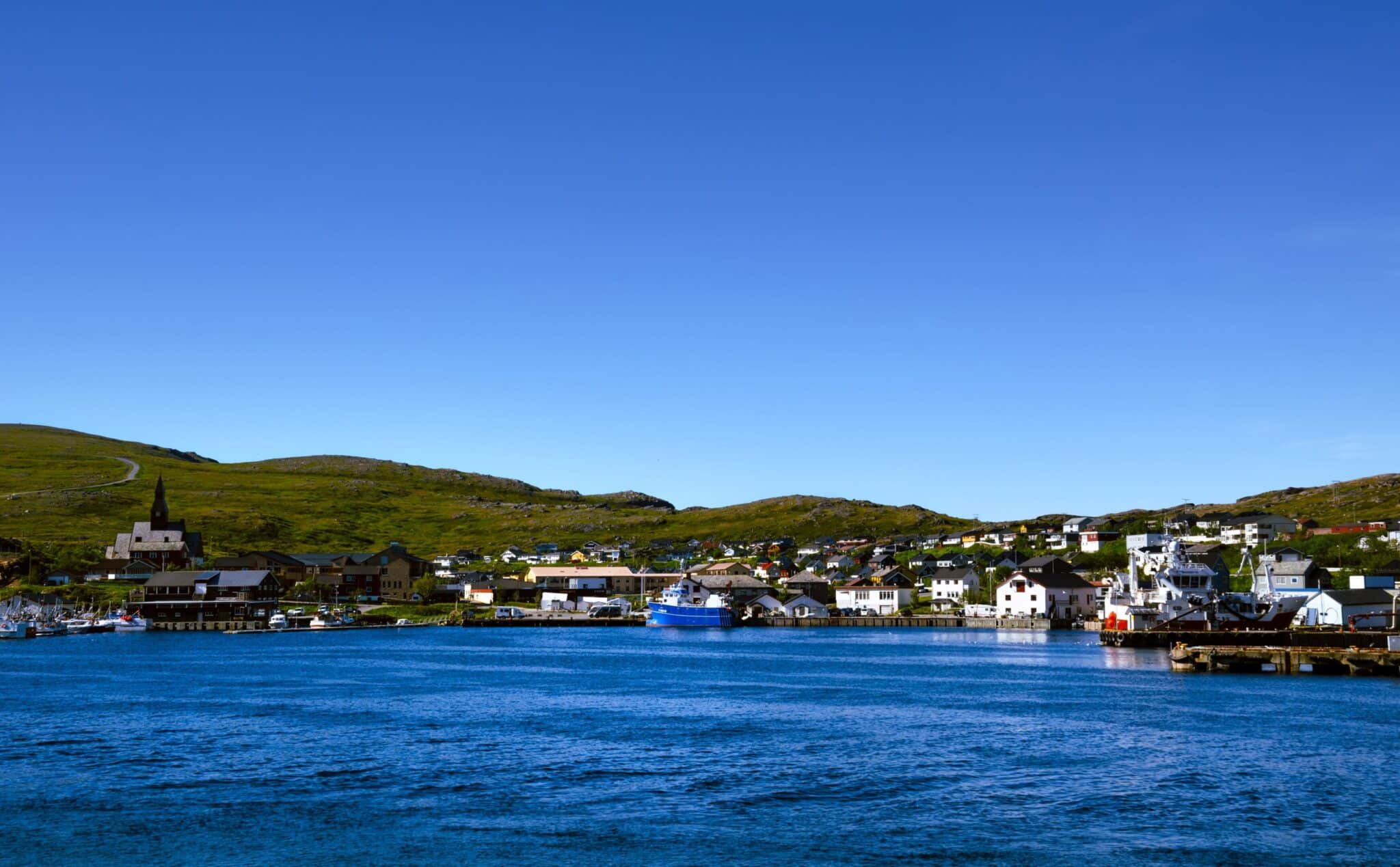 Houses church and ships in Havøysund town