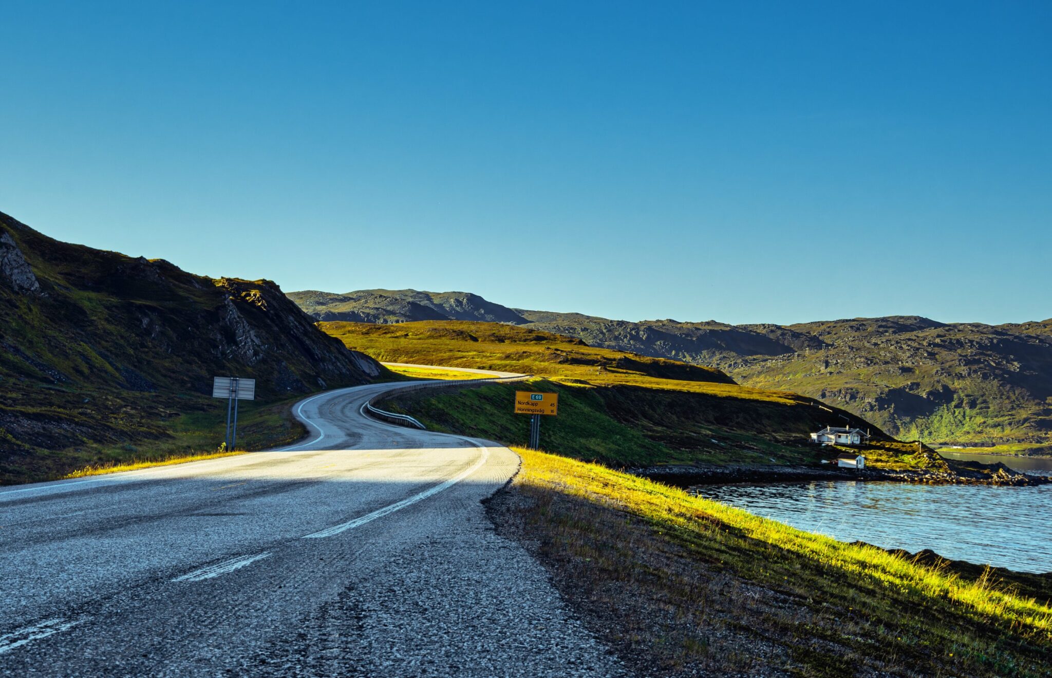 Lake, mountains and road above the Arctic Circle in Norway