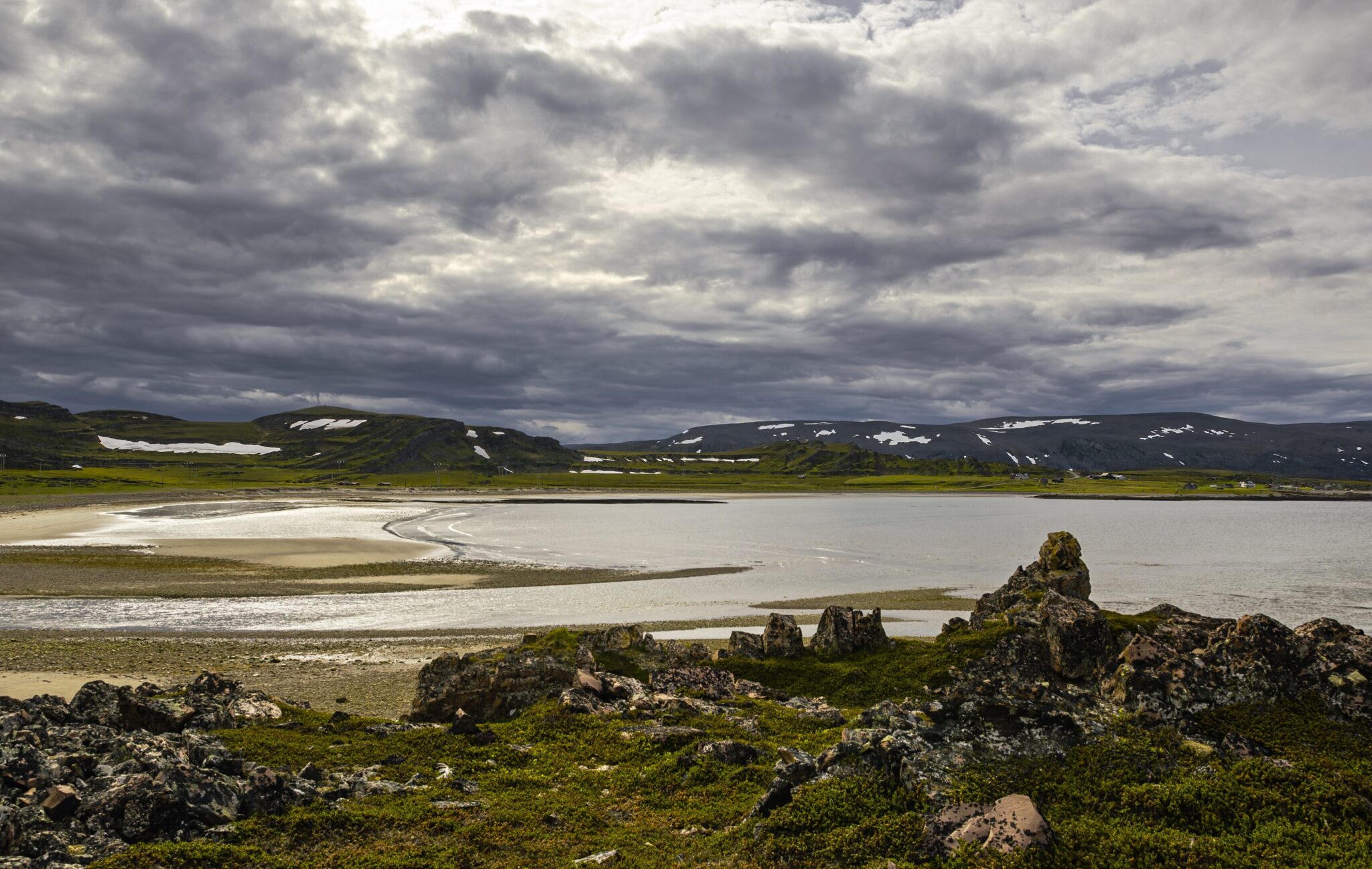 Sea beach rocks and mountains on Varanger