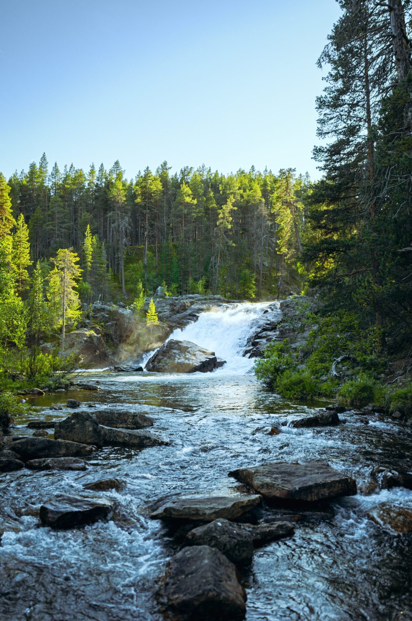 Ravadas Water Falls among trees about sunset