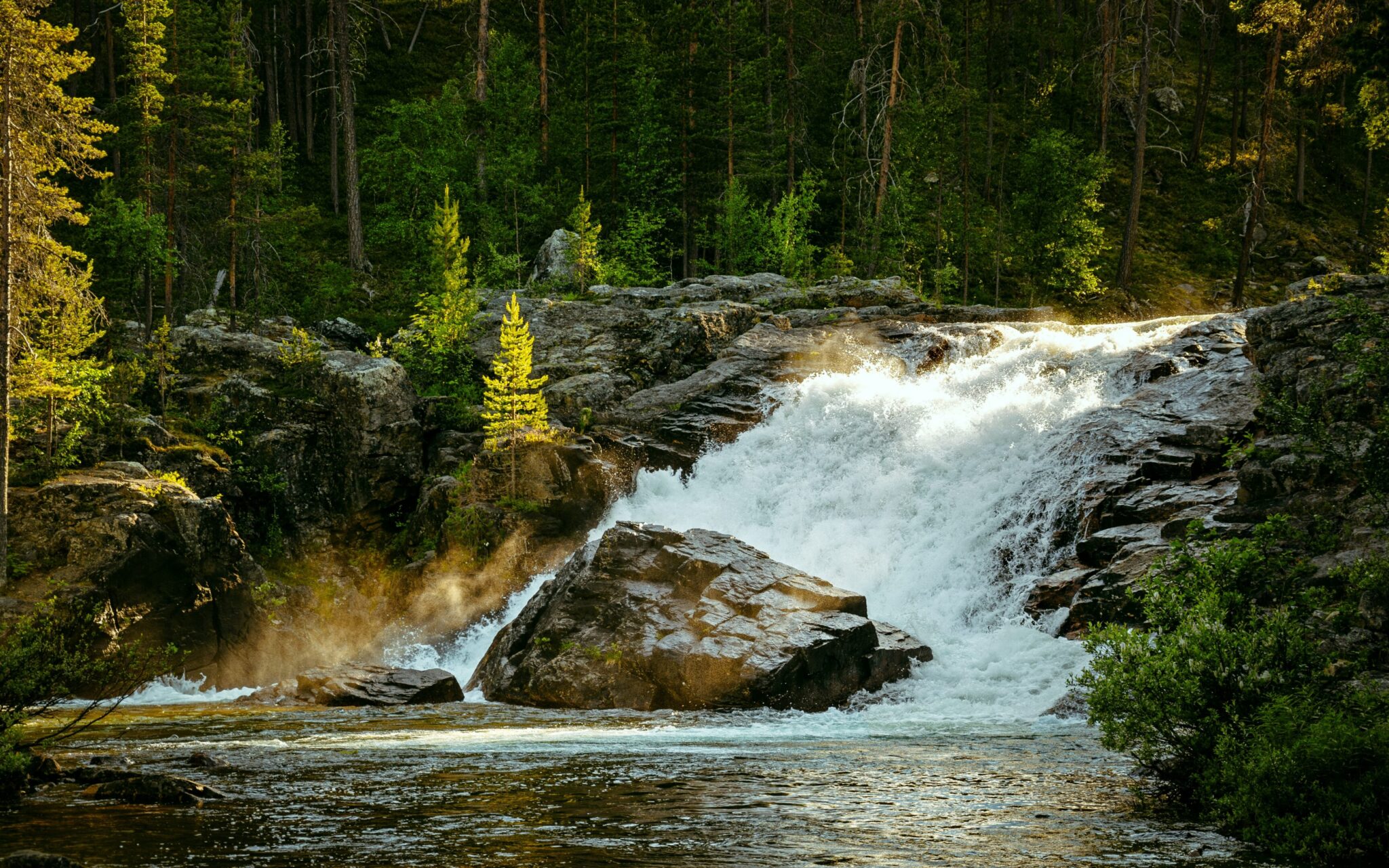 Ravadas Water Falls among trees about sunset