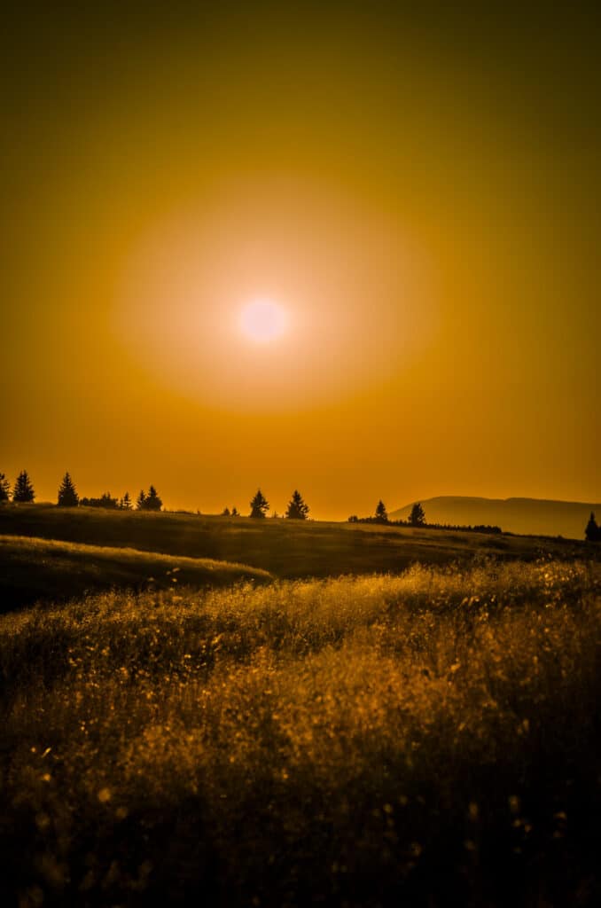 Beautiful orange and yellow sun at mountains