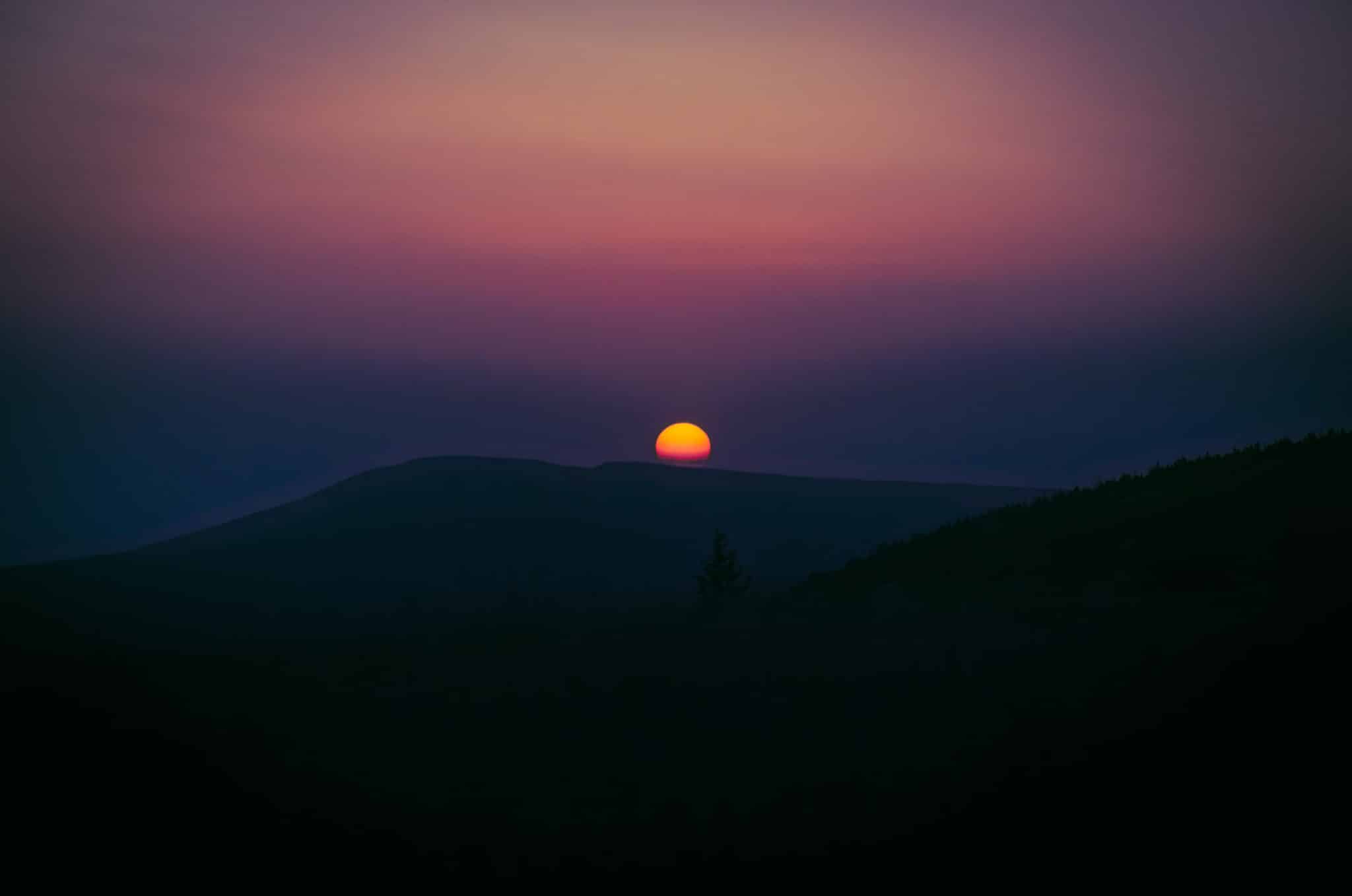 Beautiful orange and yellow sun at mountains