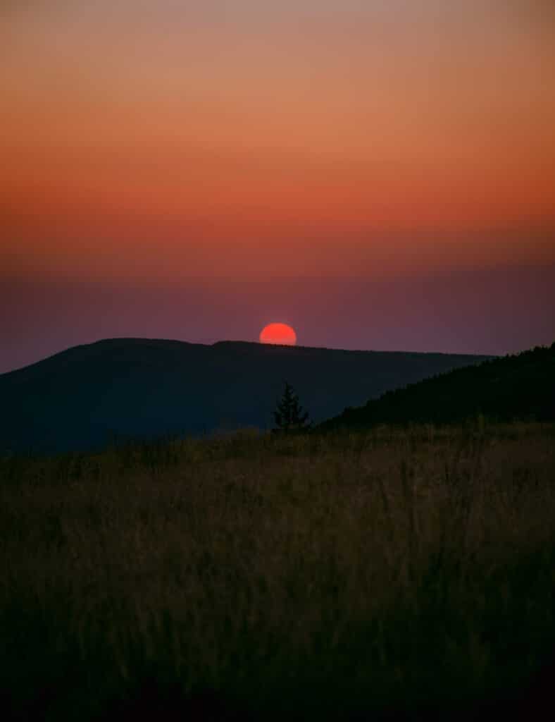 Beautiful orange and yellow sun at mountains