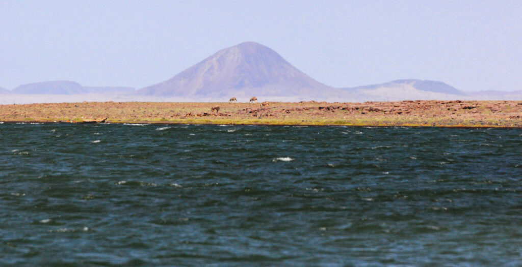 Water, sand, mountain, Lake Turkana in Africa